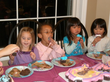 Girls loving cupcakes